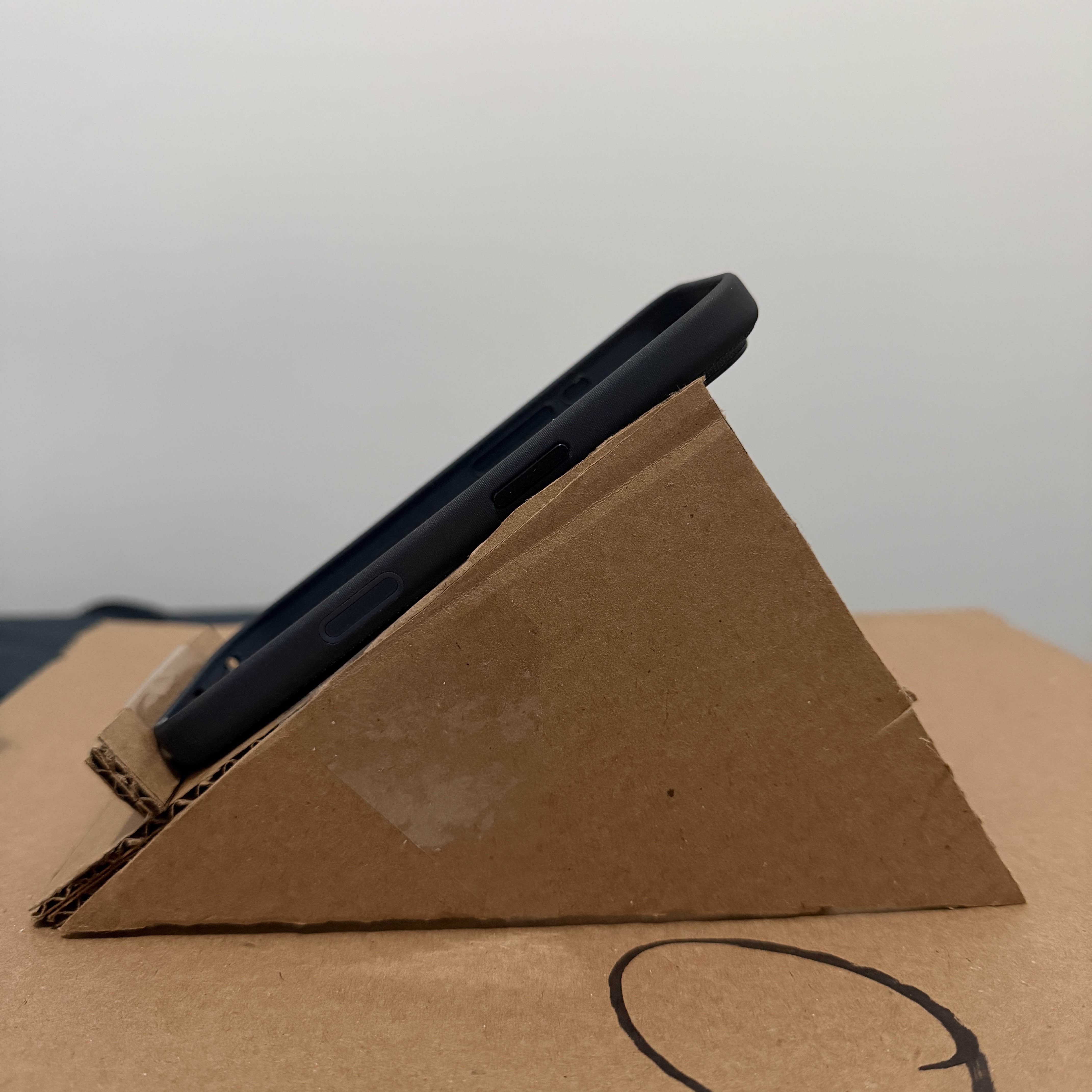 Another viewing-angle test showing how the stand holds the phone securely from the side.