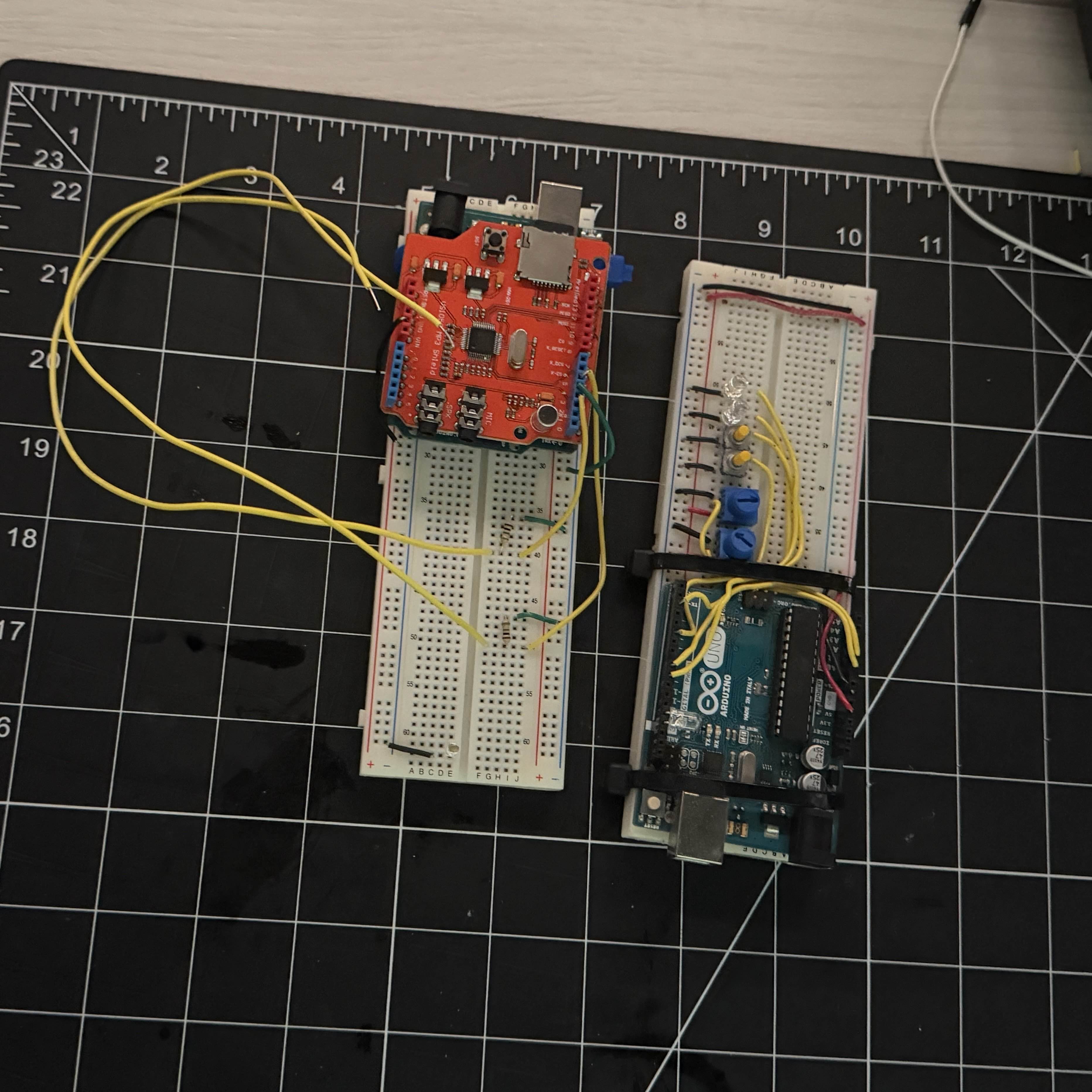Workshop documentation photo of arduino boards with LEDs, buttons and speakers.